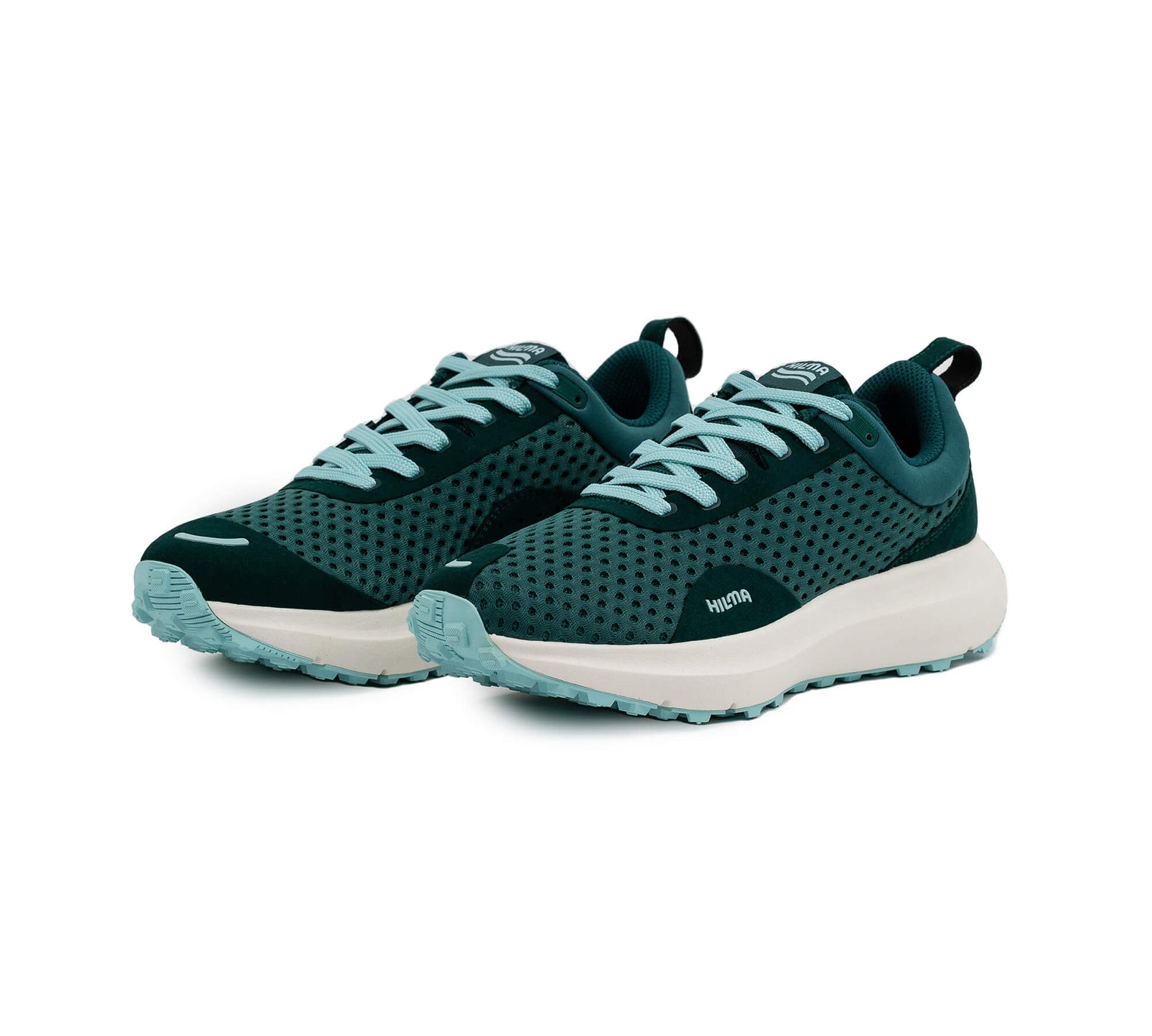Front side view of a pair of the Everywhere Hilma Running shoe in Evergreen